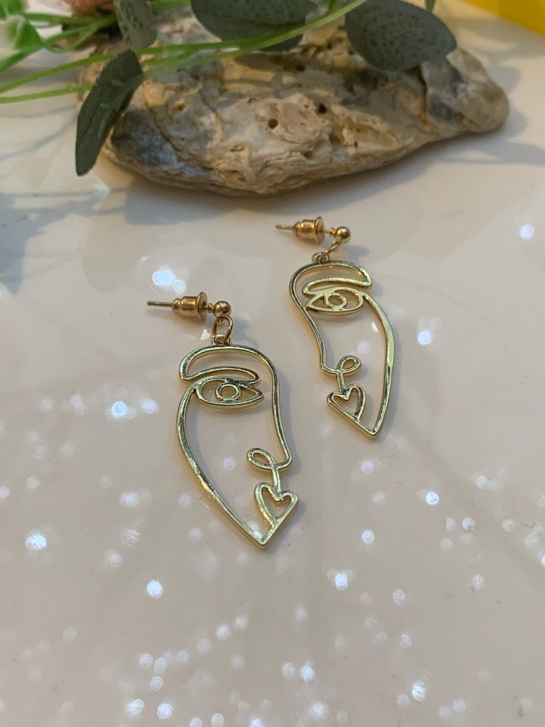 Every face have a story behind\u201d women\u2019s face earrings