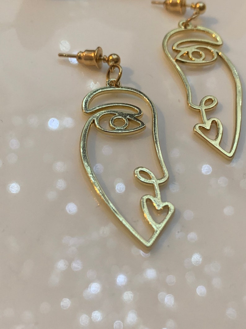 Every face have a story behind\u201d women\u2019s face earrings