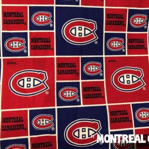 May include: A fabric pattern featuring the Montreal Canadiens logo in red, white, and blue. The design is a grid of squares with the team's logo and the words "MONTREAL CANADIENS". The text "MONTREAL GRID" is also visible.