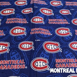 May include: Blue fabric featuring a repeating pattern of the Montreal Canadiens logo in red and white. The words "MONTREAL CANADIENS" are also printed on the fabric. The fabric has a paisley-like design.