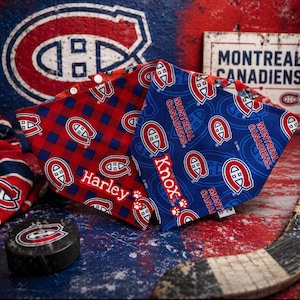 May include: Two pet bandanas featuring the Montreal Canadiens logo. One is red plaid with "Harley" embroidered, the other is blue with the team logo and "Knox" embroidered. A hockey puck and a sign that says "Montreal Canadiens" are also visible.