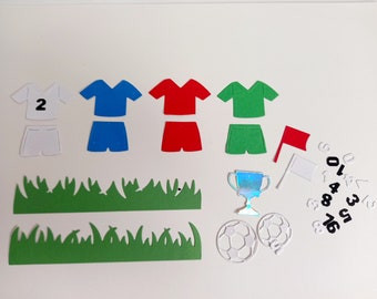 Die Cut Football Strips with Ball, Trophy, Grass, Flags and Collection of Numbers for Use in an Array of Crafts.