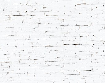 May include: White brick wall with a rough, textured surface. The bricks are arranged in a traditional pattern, with mortar lines visible between them. The wall is painted white, but the paint is chipped and peeling in places, revealing the underlying brick.