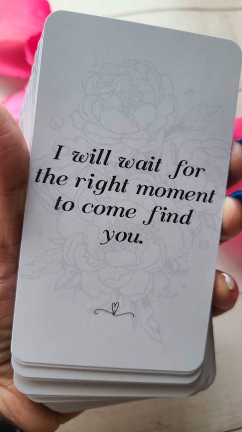 May include: A white card with a floral design and the text "I will wait for the right moment to come find you."