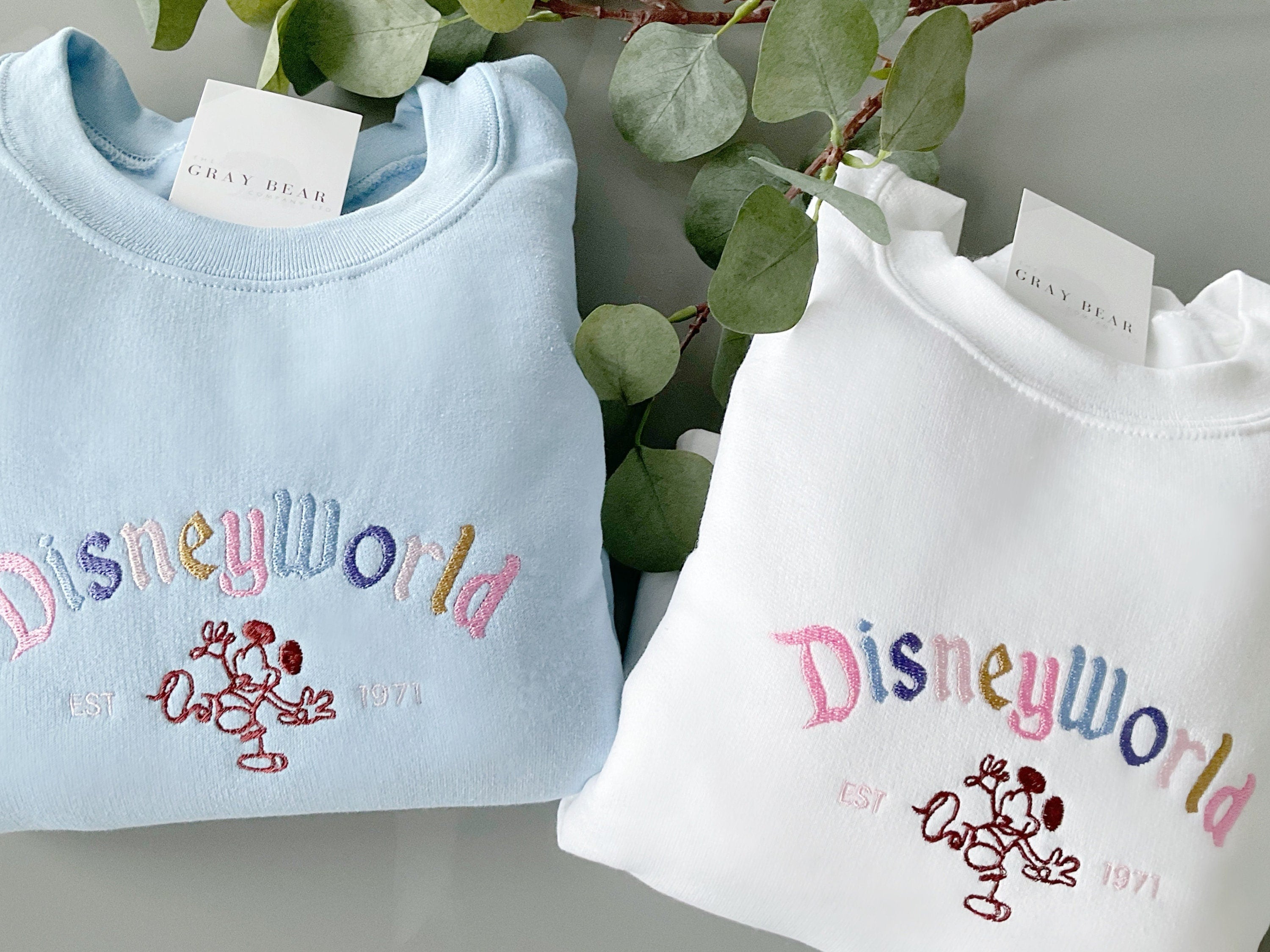 Discover Embroidered Adult Disney Sweatshirts / white and baby blue Disneyworld