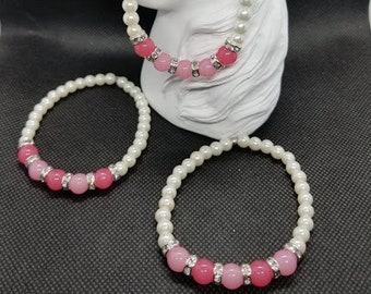 pink jade and pearl bracelets with silver rings