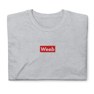 May include: Gray t-shirt with a red box that says "Weeb" in white letters.