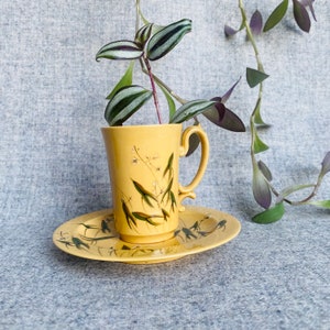 Upcycled yellow micro teacup planter with plant pattern drainage hole and matching drainage dish