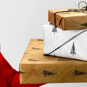 May include: Three gifts wrapped in brown paper with a black and white pine tree pattern. The top gift is tied with black string and a bow.