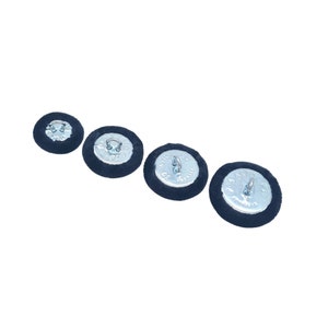 Velvet fabric covered upholstery buttons in dark navy blue