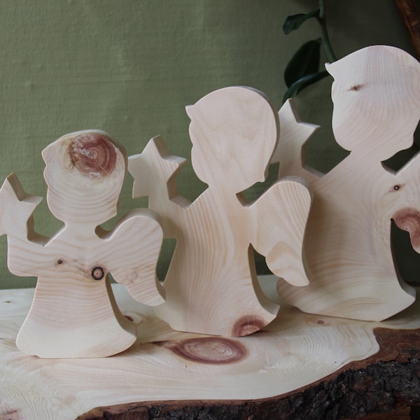 Christmas angel with star made of pine wood