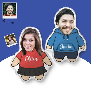 May include: Two custom-shaped plush pillows featuring printed faces of a person. One pillow shows a person in a red t-shirt and black skirt with the name Olivia, the other shows a person in a blue hoodie and dark shorts with the name Charlie.