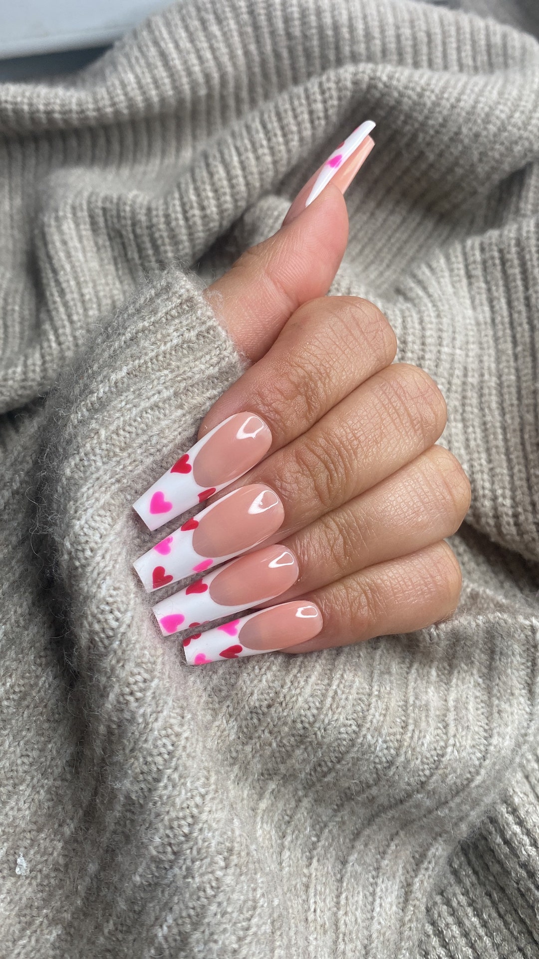 White French press-on nails with red hearts