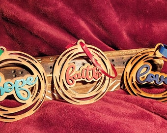 Set of three laser cut, hand painted wooden ornaments