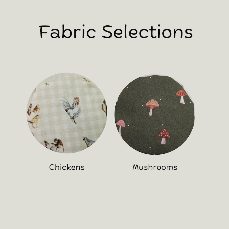 May include: Fabric Selections text above two circular fabric swatches. The left swatch features a beige gingham pattern with illustrations of chickens. The right swatch is dark olive green with a pattern of small red and white mushrooms.