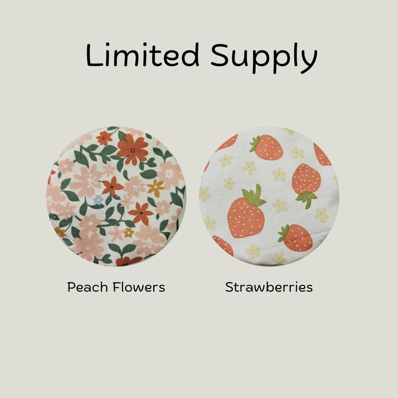 May include: Two circular fabric covers labeled Limited Supply. The left cover features a pattern of peach, orange, and green flowers. The right cover displays a pattern of red strawberries and small yellow flowers labeled Strawberries.