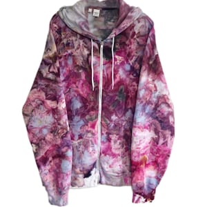 May include: A purple, pink and white tie-dye zip-up hoodie with a white zipper.