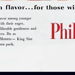 May include: Vintage advertisement for Philip Morris cigarettes. The ad features text in black and red on a white background, with the brand name prominently displayed. The text promotes the product's flavor and appeals to younger smokers.