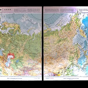 May include: A vintage map of the U.S.S.R. with a color-coded key showing elevation, from sea level to over 2,000 meters. The map includes a scale bar and a compass rose.