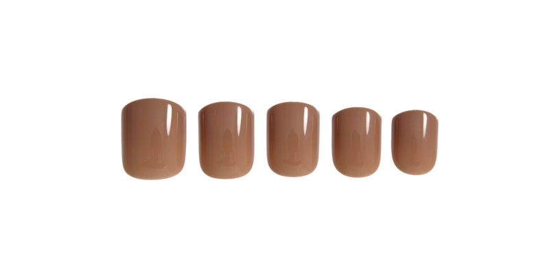 May include: A set of five press-on nails in a solid, glossy mocha brown color. Each nail features a rounded square shape with a smooth, reflective finish. The nails are arranged in a horizontal row, decreasing slightly in size from left to right.