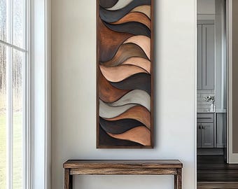 May include: A vertical, rectangular wooden wall art piece with a dark brown frame. The artwork features a series of undulating, wave-like shapes in shades of brown, grey, and cream. The piece is displayed above a wooden bench in a well-lit hallway.