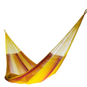 May include: A white ceramic mug with a black handle and the text "But First, Coffee" in a bold, black font. The mug is set against a neutral background, highlighting its simple design.