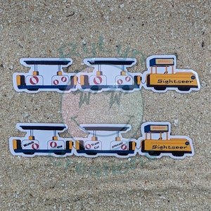 May include: Two yellow and blue toy train cars with a yellow and blue train engine. The train cars have the words "Watch the", "Tram Car", and "Please!" on them. The train engine has the words "Sightseer" on it.