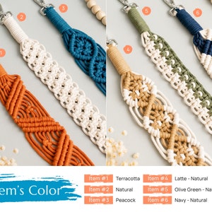 May include: Six macrame keychains in different color combinations. The keychains are made with natural cotton cord and feature a variety of colors, including terracotta, natural, peacock, olive green, and navy. The keychains are labeled with numbers 1 through 6 and their corresponding colors.