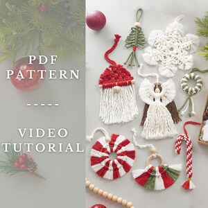 May include: A collection of handmade macrame Christmas ornaments, including a snowflake, a tree, a candy cane, a gnome, an angel, and a wreath. The ornaments are made with white and red yarn and have wooden beads. The text "PDF PATTERN VIDEO TUTORIAL" is displayed on the left side of the image.