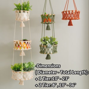 May include: Three macrame plant hangers with wooden rings and tassels. The hangers are in different colors and sizes, with one being a three-tiered hanger. -Dimensions (Diameter - Total Length): +1 Tier: 10" - 23" + 2 Tier: 8", 10"-36" + 3 Tier: 8", 10", 12" - 48"
