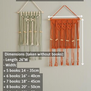May include: Two macrame wall hangings, one green and one orange, with wooden beads. The hangings are 26 inches wide and can be adjusted in length by adding books. The text "NO BOOKS INCLUDING" is at the top of the image.