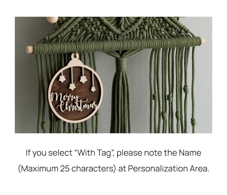 May include: A dark olive green macrame wall hanging featuring a wooden dowel and a circular wooden ornament. The ornament has a dark brown centre with light wood cutouts of four small stars and the text Merry Christmas.