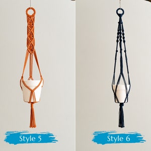May include: Two macrame plant hangers, one in orange and one in navy blue, with white pots hanging from them. The orange hanger is labeled "Style 5" and the navy blue hanger is labeled "Style 6".