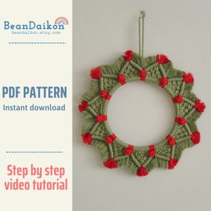 May include: A green and red macrame wreath with a starburst pattern and red tassels. The wreath is hanging on a white wall. PDF PATTERN Instant download Step by step video tutorial