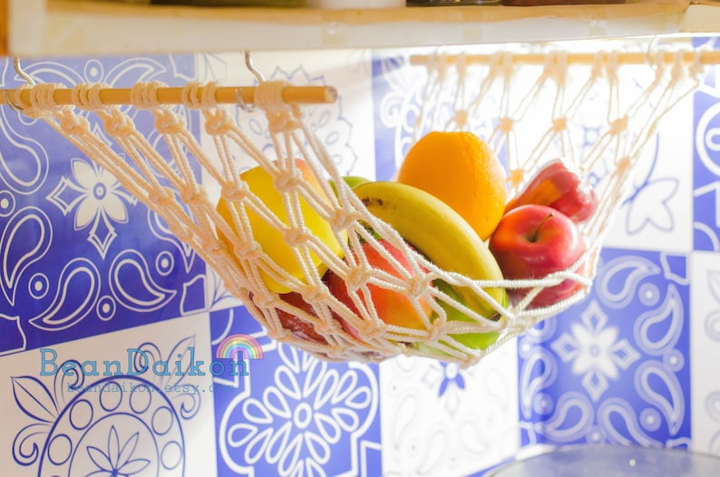 This lovely Handmade Macrame Hanging Fruit Basket is perfect for your Fruit Holder, Kitchen storage, Boho Home Decor, Kitchen Counter Saver in bohemian vibe. This could be a perfect idea for Gift for Mom, Housewarming Gift, New Home Gift.
