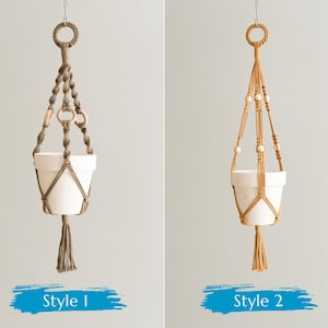 May include: Two macrame plant hangers, one in beige and one in brown, with white ceramic pots. The beige hanger has white beads and the brown hanger has wooden rings. The hangers are labeled "Style 1" and "Style 2".