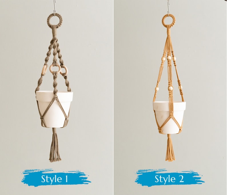 May include: Two macrame plant hangers, one in beige and one in brown, with white ceramic pots. The beige hanger has white beads and the brown hanger has wooden rings. The hangers are labeled "Style 1" and "Style 2".