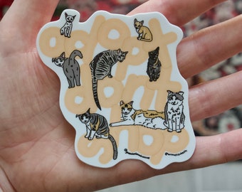 以下が含まれることがあります： 薄いオレンジ色の背景に、さまざまなポーズをとった猫が描かれたステッカー。"Adopt Don't Shop"という文字がスタイリッシュなフォントで書かれています。