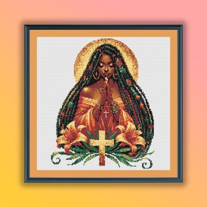 May include: A cross stitch pattern featuring a woman with long braids, wearing a red and orange dress, praying with her hands clasped. She is surrounded by lilies and greenery. The background is a golden halo.
