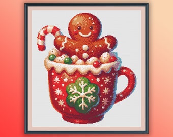 May include: A red mug with white snowflakes and a green snowflake design. The mug is filled with white marshmallows and red and green candies. A gingerbread man is sitting on top of the marshmallows.