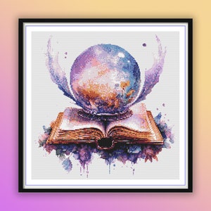 May include: A framed watercolor-style print featuring a crystal ball atop an open book. The crystal ball is a mix of blue, purple, and orange hues, with feathery accents. The book is open, with detailed pages and floral accents.
