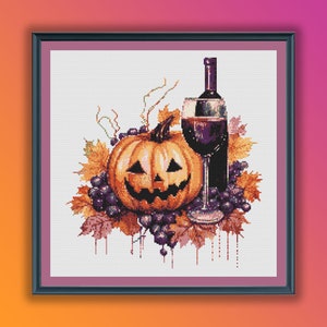 May include: A cross-stitch pattern featuring a jack-o'-lantern, a glass of red wine, and a bottle of wine, all surrounded by grapes and autumn leaves.