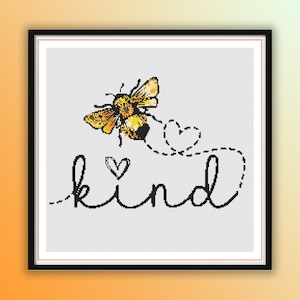 May include: A cross-stitch pattern featuring a bee with yellow and black stripes flying with a heart-shaped trail that says "kind".