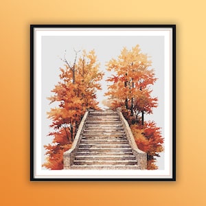 May include: A stone staircase leading up through a grove of trees with orange and red fall foliage.