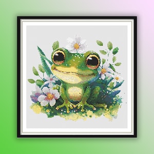 May include: A green frog with big eyes sits in a bed of white flowers and green leaves. The frog is smiling and has a happy expression.