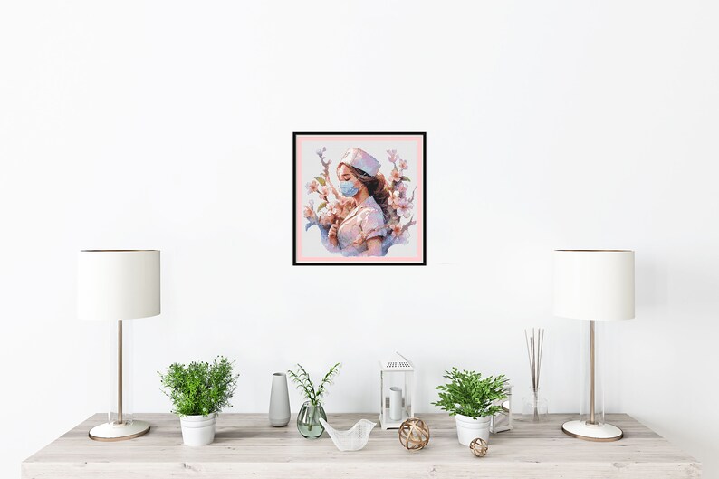 May include: A watercolour painting of a woman wearing a nurse's uniform and a face mask, standing in front of a pink and white floral background.