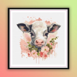 May include: A white calf with black markings around its eyes and nose is surrounded by pink watercolor flowers. The calf is looking directly at the viewer.