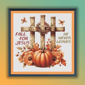 May include: Cross stitch pattern featuring two wooden crosses with a wreath of thorns and a pumpkin. The text "Fall for Jesus" and "He Never Leaves" is included in the design.