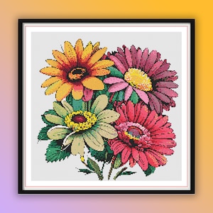 Könnte beinhalten: Ein Kreuzstichmuster mit einem Strauß bunter Blumen. Die Blumen sind eine Mischung aus Gelb, Orange, Rosa und Rot. Die Blumen sind in einer Gruppe angeordnet und haben ein detailliertes Design.