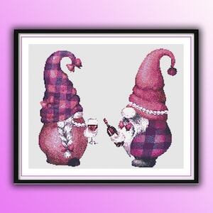 May include: Cross-stitch art featuring two gnomes, one holding a wine bottle and the other a glass of wine. The gnomes wear tall, pointed hats and plaid outfits in shades of pink and purple. A pearl necklace adorns one gnome.